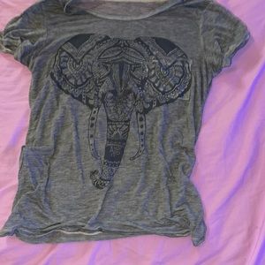 A grey tee-shirt with a elephant design